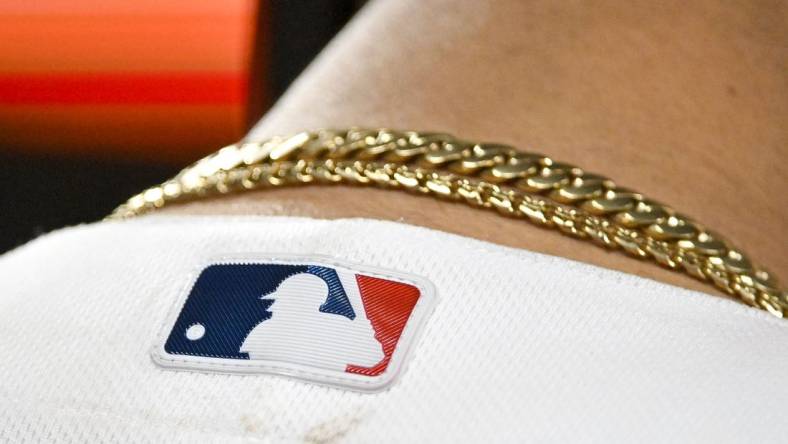 Jun 12, 2023; St. Louis, Missouri, USA;  A detailed view of the MLB logo on the back of St. Louis Cardinals catcher Willson Contreras (40) jersey during the eighth inning against the San Francisco Giants at Busch Stadium. Mandatory Credit: Jeff Curry-USA TODAY Sports