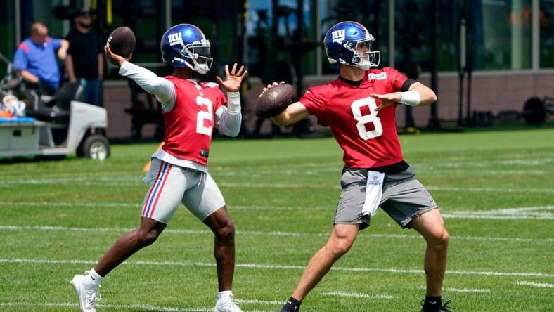 New York Giants quarterbacks Daniel Jones (8) and Tyrod Taylor (2) throw the ball on the first day of mandatory minicamp at the Giants training center in East Rutherford on Tuesday, June 13, 2023.