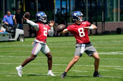 New York Giants quarterbacks Daniel Jones (8) and Tyrod Taylor (2) throw the ball on the first day of mandatory minicamp at the Giants training center in East Rutherford on Tuesday, June 13, 2023.