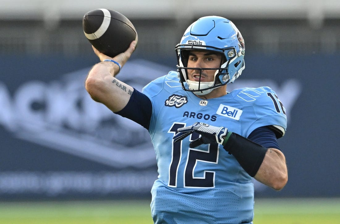 Jun 18, 2023; Toronto, Ontario, CAN;  Toronto Argonauts quarterback Chad Kelly (12) throws a pass against the Hamilton Tiger-Cats in the second quarter at BMO Field. Mandatory Credit: Dan Hamilton-USA TODAY Sports