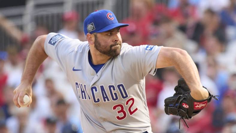 Jun 25, 2023; London, GBR, ENG;  Chicago Cubs relief pitcher Michael Fulmer (32) throws against the St. Louis Cardinals  in London series game two at London Stadium. Mandatory Credit: Peter van den Berg-USA TODAY Sports