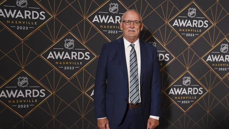 Jun 26, 2023; Nashville, Tennessee, USA; New Jersey Devils head coach Lindy Ruff arrives on the red carpet before the 2023 NHL Awards at Bridgestone Arena. Mandatory Credit: Christopher Hanewinckel-USA TODAY Sports