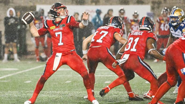 Jul 1, 2023; Montreal, Quebec, CAN; Montreal Alouettes quarterback Cody Fajardo (7) passes the ball against the Winnipeg Blue Bombers during the fourth quarter at Percival Molson Memorial Stadium. Mandatory Credit: David Kirouac-USA TODAY Sports