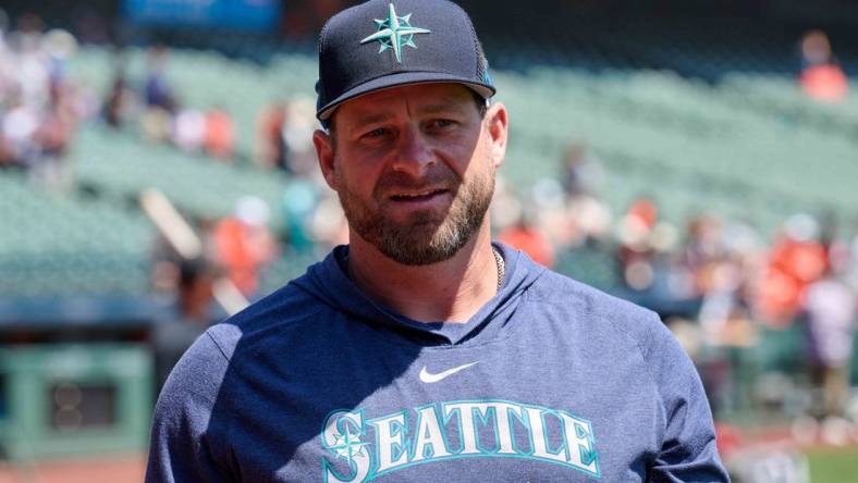 Jul 4, 2023; San Francisco, California, USA; Seattle Mariners bullpen coach and quality control coach Stephen Vogt (13) walks on the field before the game against the San Francisco Giants at Oracle Park. Mandatory Credit: Robert Edwards-USA TODAY Sports