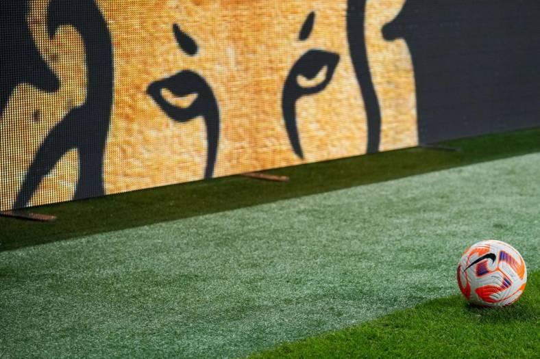 Jul 9, 2023; Cincinnati, Ohio, USA;  A Nike game ball is seen on the field alongside the Modelo Beer logo on the sideboards during the match between Canada and the United States at TQL Stadium. Mandatory Credit: Aaron Doster-USA TODAY Sports