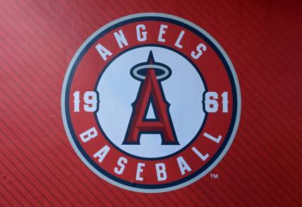 Jul 21, 2023; Anaheim, California, USA;  Detailed view of the Los Angeles Angels team logo on the wall of the dugout at Angel Stadium. Mandatory Credit: Jayne Kamin-Oncea-USA TODAY Sports