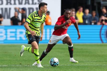 Jul 22, 2023; East Rutherford, New Jersey, USA; Arsenal forward Gabriel Martinelli (11) controls the ball in front of Manchester United defender Aaron Wan-Bissaka (29) during the first half at MetLife Stadium. Mandatory Credit: Vincent Carchietta-USA TODAY Sports