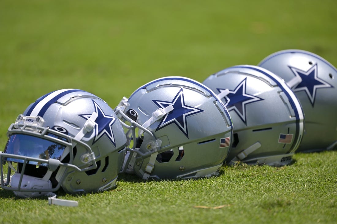 Jul 26, 2023; Oxnard, CA, USA; General view of player helmets on the field during training camp at River Ridge Playing Fields in Oxnard, CA. Mandatory Credit: Jayne Kamin-Oncea-USA TODAY Sports