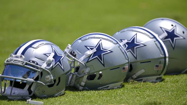 Jul 26, 2023; Oxnard, CA, USA; General view of player helmets on the field during training camp at River Ridge Playing Fields in Oxnard, CA. Mandatory Credit: Jayne Kamin-Oncea-USA TODAY Sports