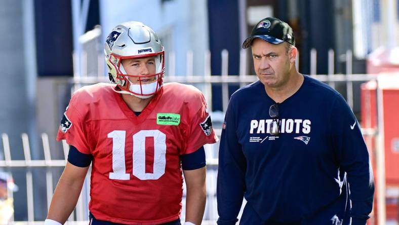 Aug 3, 2023; Foxborough, MA, USA; New England Patriots quarterback Mac Jones (10) and offensive coordinator/quarterbacks coach Bill O'Brien head to the practice fields for  training camp at Gillette Stadium.  Mandatory Credit: Eric Canha-USA TODAY Sports