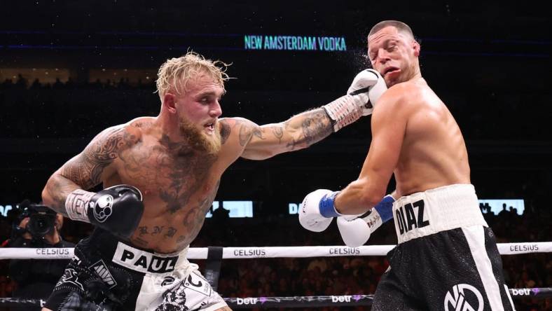 Aug 5, 2023; Dallas, Texas, USA;  Jake Paul (left) fights  against Nate Diaz in a boxing match at American Airlines Center. Mandatory Credit: Kevin Jairaj-USA TODAY Sports