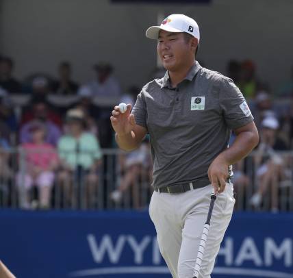 Aug 6, 2023; Greensboro, North Carolina, USA; Byeong Hun An shows the ball after a birdie on the 9th green during the final round of the Wyndham Championship golf tournament. Mandatory Credit: David Yeazell-USA TODAY Sports