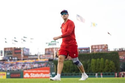 Aug 8, 2023; Philadelphia, Pennsylvania, USA; Philadelphia Phillies Rhys Hoskins walks the field while on injured reserve before a game against the Washington Nationals at Citizens Bank Park. Mandatory Credit: Bill Streicher-USA TODAY Sports