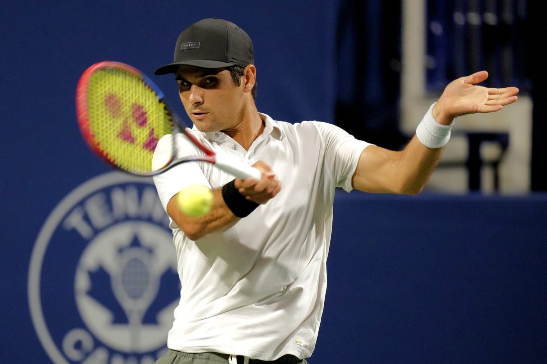 Aug 9, 2023; Toronto, Ontario, Canada; Marcos Giron (USA) hits a ball to Holger Rune (not pictured) at Sobeys Stadium. Mandatory Credit: John E. Sokolowski-USA TODAY Sports