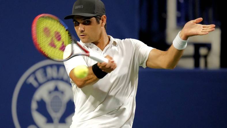 Aug 9, 2023; Toronto, Ontario, Canada; Marcos Giron (USA) hits a ball to Holger Rune (not pictured) at Sobeys Stadium. Mandatory Credit: John E. Sokolowski-USA TODAY Sports