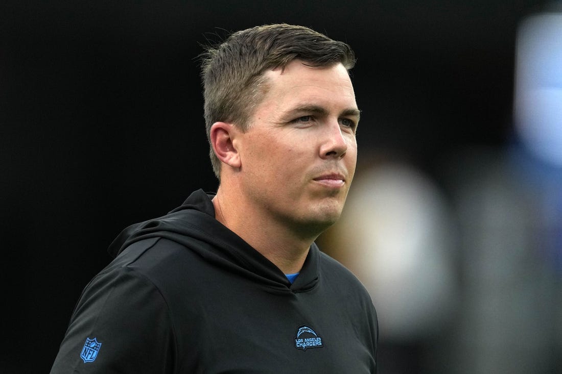 Aug 12, 2023; Inglewood, California, USA;  Los Angeles Chargers offensive coordinator Kellen Moore watches during the game against the Los Angeles Rams at SoFi Stadium. Mandatory Credit: Kirby Lee-USA TODAY Sports