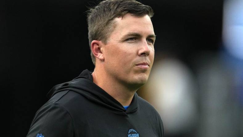 Aug 12, 2023; Inglewood, California, USA;  Los Angeles Chargers offensive coordinator Kellen Moore watches during the game against the Los Angeles Rams at SoFi Stadium. Mandatory Credit: Kirby Lee-USA TODAY Sports