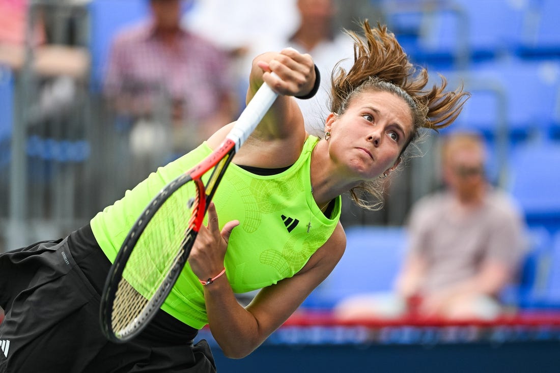 Aug 10, 2023; Montreal, Quebec, Canada; Daria Kasatkina serves the ball to Marie Bouzkova (CZE) (not pictured) during third round play at IGA Stadium. Mandatory Credit: David Kirouac-USA TODAY Sports