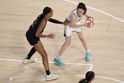 Aug 15, 2023; Las Vegas, Nevada, USA; Las Vegas Aces forward A'ja Wilson (22) defends New York Liberty forward Breanna Stewart (30) during the first quarter at Michelob Ultra Arena. Mandatory Credit: Candice Ward-USA TODAY Sports
