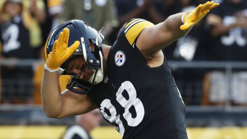 Aug 19, 2023; Pittsburgh, Pennsylvania, USA; Pittsburgh Steelers tight end Pat Freiermuth (88) celebrates his 25-yard touchdown reception against the Buffalo Bills during the first quarter at Acrisure Stadium. Mandatory Credit: Charles LeClaire-USA TODAY Sports