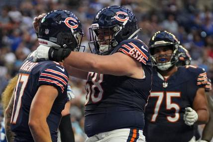 Chicago Bears center Doug Kramer (68) quarterback Tyson Bagent (17) celebrate a touchdown by Bagent during the first half of an NFL preseason game Saturday, Aug. 19, 2023, at Lucas Oil Stadium in Indianapolis.