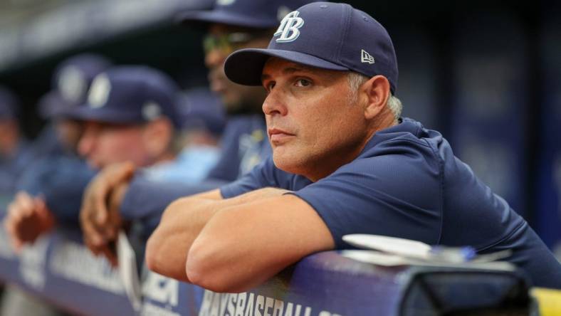 Aug 24, 2023; St. Petersburg, Florida, USA;  Tampa Bay Rays manager Kevin Cash (16) looks on from the dugout against the Colorado Rockies in the third inning at Tropicana Field. Mandatory Credit: Nathan Ray Seebeck-USA TODAY Sports