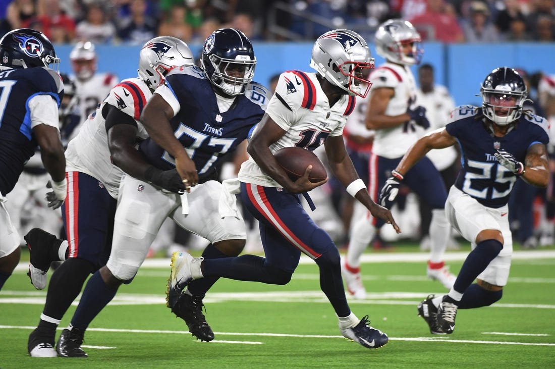 Aug 25, 2023; Nashville, Tennessee, USA; New England Patriots quarterback Malik Cunningham (16) runs for a short gain during the second half against the Tennessee Titans at Nissan Stadium. Mandatory Credit: Christopher Hanewinckel-USA TODAY Sports