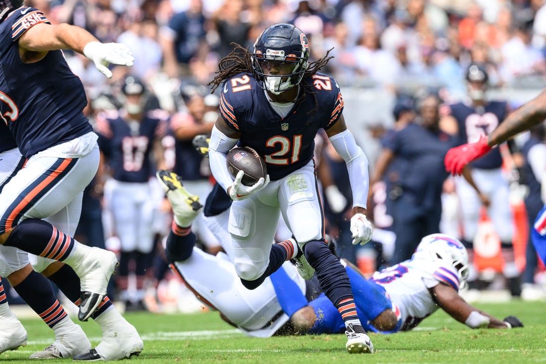 Aug 26, 2023; Chicago, Illinois, USA; Chicago Bears running back D'Onta Foreman (21) runs the ball against the Buffalo Bills during the second quarter at Soldier Field. Mandatory Credit: Daniel Bartel-USA TODAY Sports