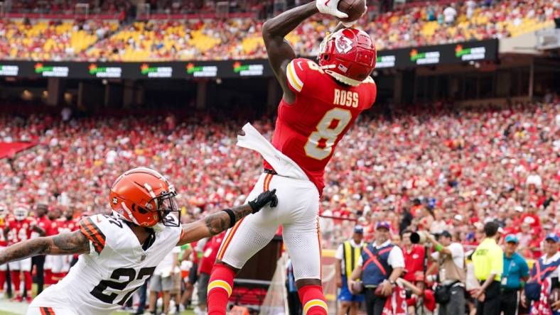 Aug 26, 2023; Kansas City, Missouri, USA; Kansas City Chiefs wide receiver Justyn Ross (8) catches a pass for a touchdown against Cleveland Browns cornerback Lorenzo Burns (27) during the first half at GEHA Field at Arrowhead Stadium. Mandatory Credit: Denny Medley-USA TODAY Sports