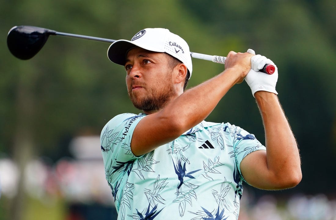 Aug 27, 2023; Atlanta, Georgia, USA; Xander Schauffele plays his shot from the sixth tee during the final round of the TOUR Championship golf tournament at East Lake Golf Club. Mandatory Credit: John David Mercer-USA TODAY Sports