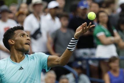 Aug 28, 2023; Flushing, NY, USA; Felix Auger-Aliassime of Canada serves against Mackenzie McDonald of the United States (not pictured) on day one of the 2023 US Open at the Billie Jean King National Tennis Center. Mandatory Credit: Geoff Burke-USA TODAY Sports