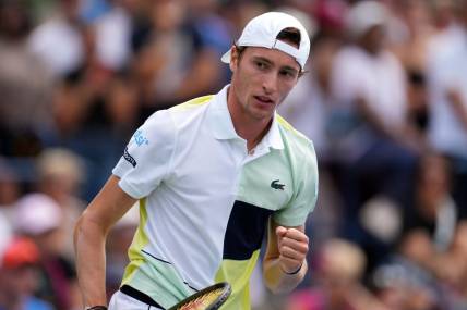 Aug 29, 2023; Flushing, NY, USA; Ugo Humbert of France wins a game in the first set against Matteo Berrettini of Italy on day two of the 2023 U.S. Open tennis tournament at USTA Billie Jean King National Tennis Center. Mandatory Credit: Danielle Parhizkaran-USA TODAY Sports