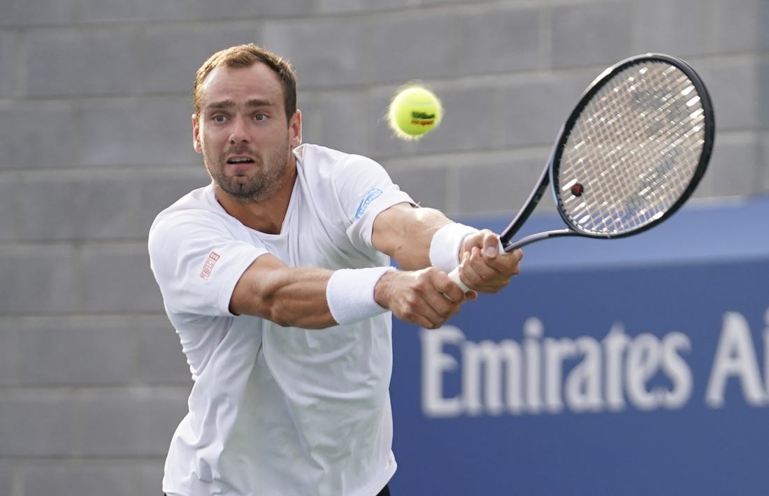 Aug 30, 2023; Flushing, NY, USA; Roman Safiullin hits to Tommy Paul of the United States on day three of the 2023 U.S. Open tennis tournament at USTA Billie Jean King National Tennis Center. Mandatory Credit: Danielle Parhizkaran-USA TODAY Sports