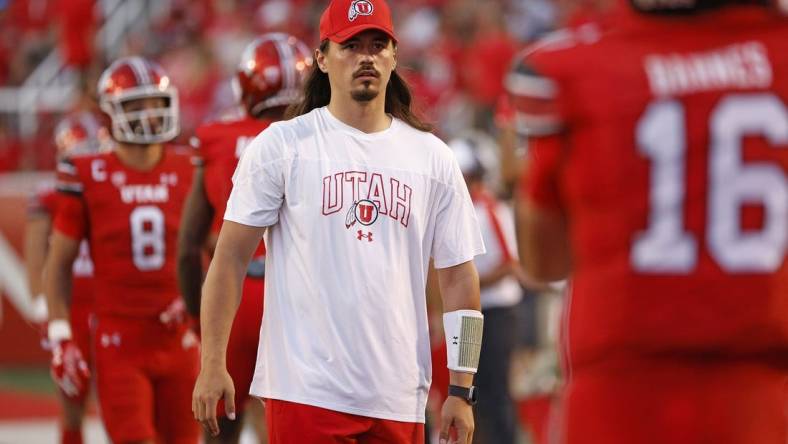 Aug 31, 2023; Salt Lake City, Utah, USA; Utah Utes quarterback Cameron Rising (7), out with an injury warms his quarterback up at halftime against the Florida Gators at Rice-Eccles Stadium. Mandatory Credit: Jeff Swinger-USA TODAY Sports