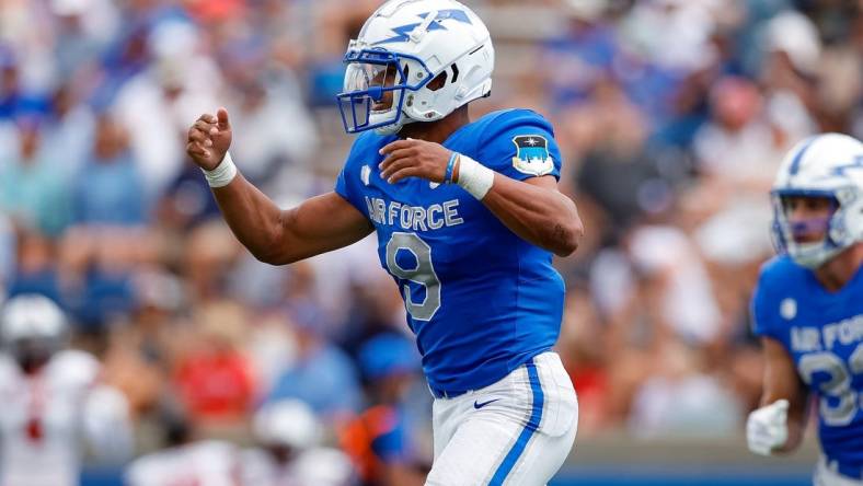 Sep 2, 2023; Colorado Springs, Colorado, USA; Air Force Falcons quarterback Zac Larrier (9) celebrates after scoring a touchdown in the third quarter against the Robert Morris Colonials at Falcon Stadium. Mandatory Credit: Isaiah J. Downing-USA TODAY Sports