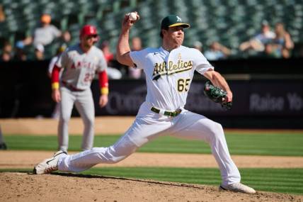 Sep 3, 2023; Oakland, California, USA; Oakland Athletics pitcher Trevor May (65) throws a pitch against the Los Angeles Angels during the ninth inning at Oakland-Alameda County Coliseum. Mandatory Credit: Robert Edwards-USA TODAY Sports