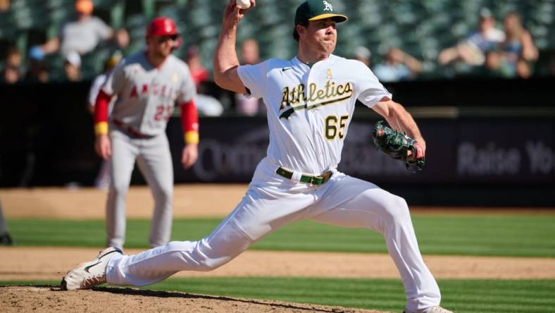 Sep 3, 2023; Oakland, California, USA; Oakland Athletics pitcher Trevor May (65) throws a pitch against the Los Angeles Angels during the ninth inning at Oakland-Alameda County Coliseum. Mandatory Credit: Robert Edwards-USA TODAY Sports