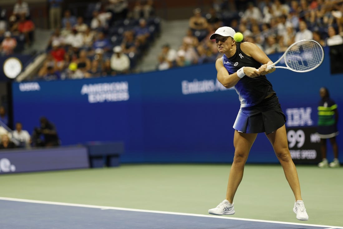 Sep 3, 2023; Flushing, NY, USA; Iga Swiatek of Poland hits a backhand against Jelena Ostapenko of Latvia (not pictured) on day seven of the 2023 U.S. Open tennis tournament at USTA Billie Jean King National Tennis Center. Mandatory Credit: Geoff Burke-USA TODAY Sports