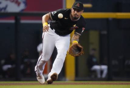 Arizona Diamondbacks' Jace Peterson (6) fields a ground ball at third base against the Baltimore Orioles at Chase Field in Phoenix on Sept. 3, 2023.