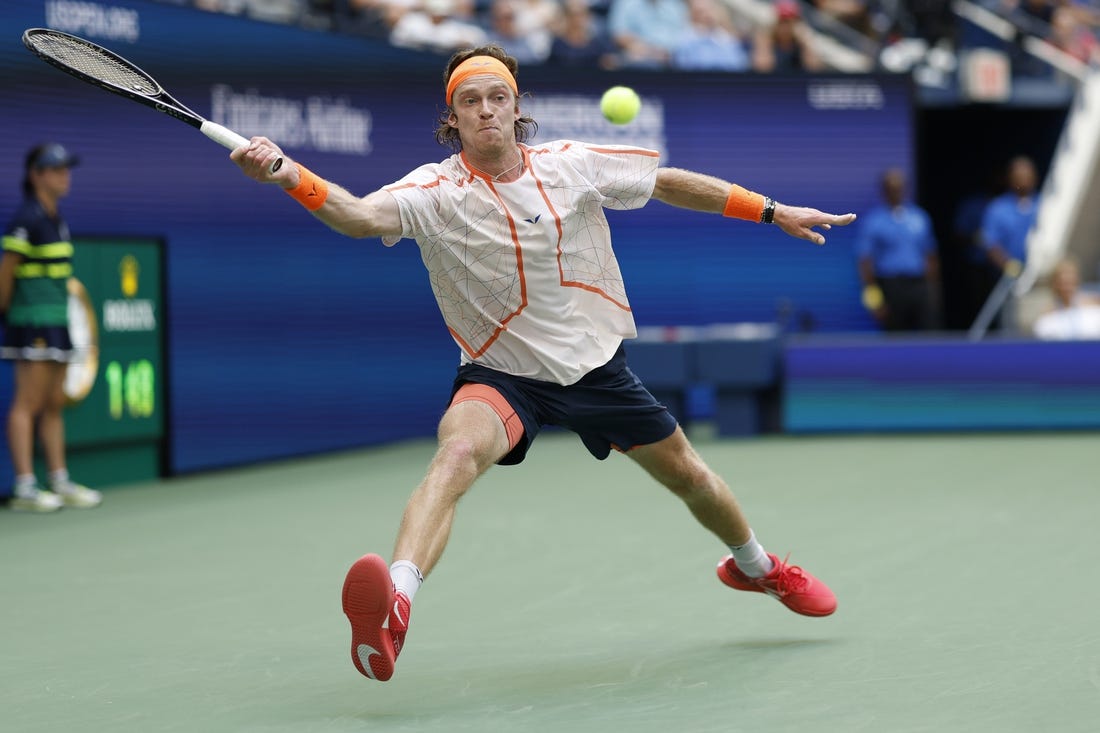 Sep 6, 2023; Flushing, NY, USA; Andrey Rublev reaches for a forehand against Daniil Medvedev (not pictured) on day ten of the 2023 U.S. Open tennis tournament at USTA Billie Jean King National Tennis Center. Mandatory Credit: Geoff Burke-USA TODAY Sports