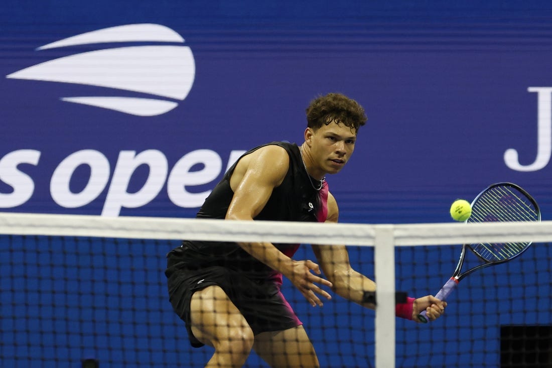 Sep 8, 2023; Flushing, NY, USA; Ben Shelton of the United States hits a volley against Novak Djokovic of Serbia (not pictured) in a men's singles semifinal on day twelve of the 2023 U.S. Open tennis tournament at USTA Billie Jean King Tennis Center. Mandatory Credit: Geoff Burke-USA TODAY Sports