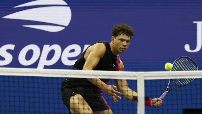 Sep 8, 2023; Flushing, NY, USA; Ben Shelton of the United States hits a volley against Novak Djokovic of Serbia (not pictured) in a men's singles semifinal on day twelve of the 2023 U.S. Open tennis tournament at USTA Billie Jean King Tennis Center. Mandatory Credit: Geoff Burke-USA TODAY Sports