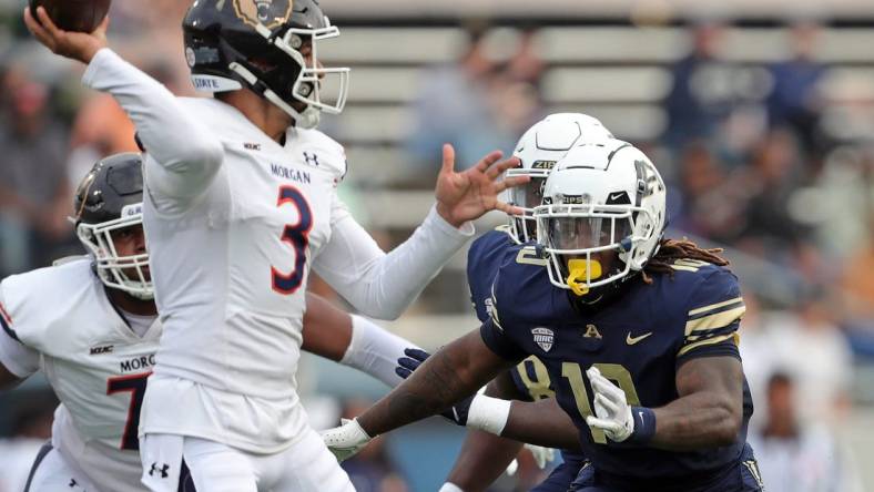 Akron linebacker Antavious Fish closes in on Morgan State quarterback Carson Baker in the first half, Saturday, Sept. 9, 2023.