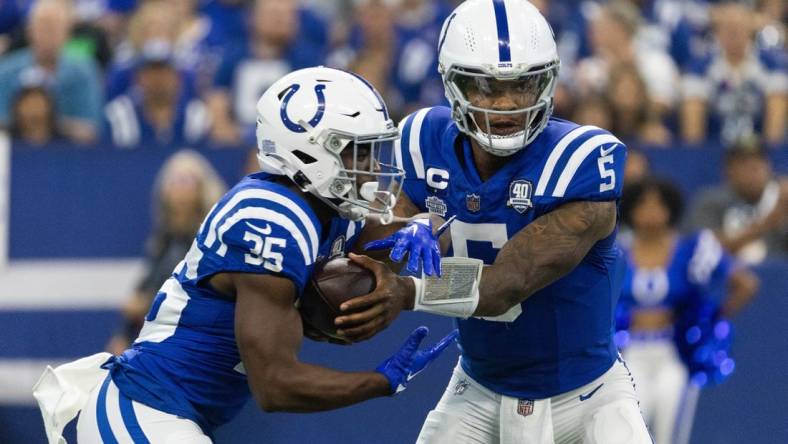 Sep 10, 2023; Indianapolis, Indiana, USA; Indianapolis Colts quarterback Anthony Richardson (5) hands the ball off to running back Deon Jackson (35)  in the first quarter against the Jacksonville Jaguars at Lucas Oil Stadium. Mandatory Credit: Trevor Ruszkowski-USA TODAY Sports