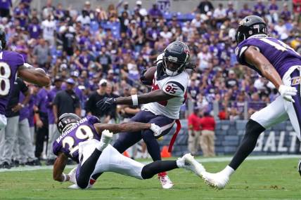 Sep 10, 2023; Baltimore, Maryland, USA; Houston Texans wide receiver Noah Brown (85) gains yardage after a second quarter catch defended by Baltimore Ravens safety Ar   Darius Washington (29) at M&T Bank Stadium. Mandatory Credit: Mitch Stringer-USA TODAY Sports