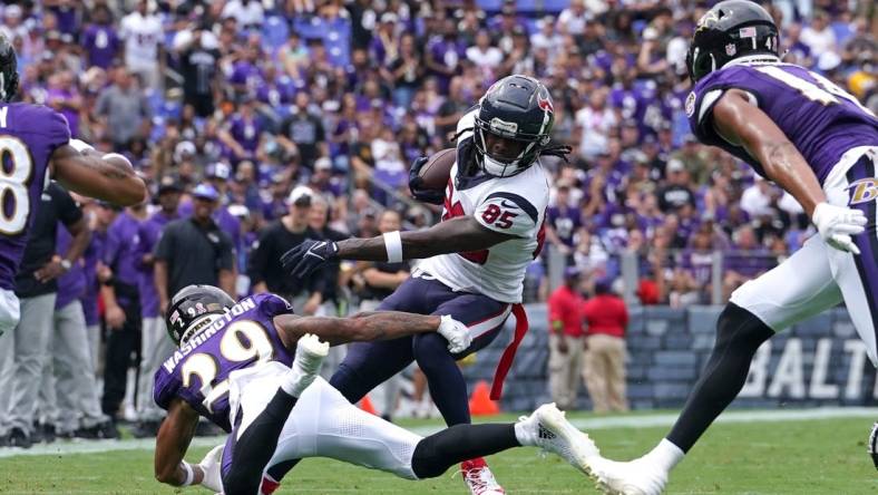 Sep 10, 2023; Baltimore, Maryland, USA; Houston Texans wide receiver Noah Brown (85) gains yardage after a second quarter catch defended by Baltimore Ravens safety Ar   Darius Washington (29) at M&T Bank Stadium. Mandatory Credit: Mitch Stringer-USA TODAY Sports