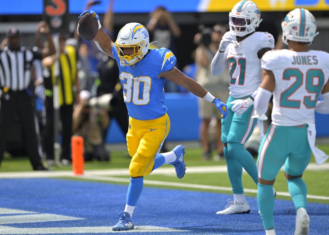 Sep 10, 2023; Inglewood, California, USA; Los Angeles Chargers running back Austin Ekeler (30) celebrates after a touchdown in the first half against the Miami Dolphins at SoFi Stadium. Mandatory Credit: Jayne Kamin-Oncea-USA TODAY Sports