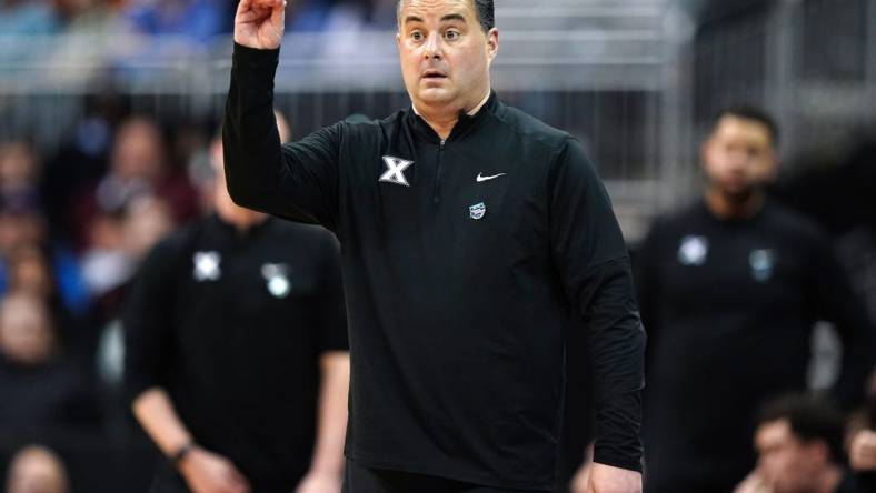 Xavier Musketeers head coach Sean Miller instructs the team during the first half of a Sweet 16 college basketball game between the Xavier Musketeers and the Texas Longhorns in the Midwest Regional of the NCAA Tournament, Friday, March 24, 2023, at T-Mobile Center in Kansas City, Mo.

Ncaa Xavier Texas Ncaa Sweet 16 March 24 0318