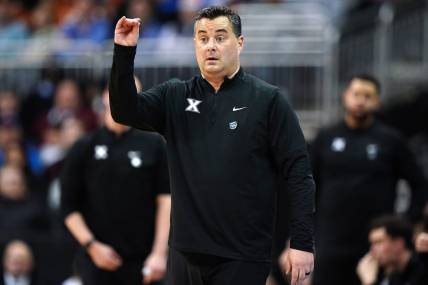 Xavier Musketeers head coach Sean Miller instructs the team during the first half of a Sweet 16 college basketball game between the Xavier Musketeers and the Texas Longhorns in the Midwest Regional of the NCAA Tournament, Friday, March 24, 2023, at T-Mobile Center in Kansas City, Mo.

Ncaa Xavier Texas Ncaa Sweet 16 March 24 0318