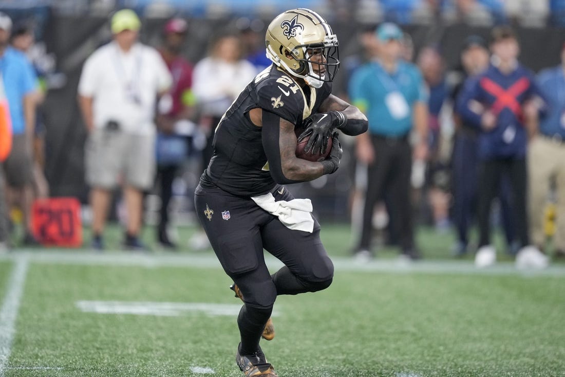 Sep 18, 2023; Charlotte, North Carolina, USA; New Orleans Saints running back Jamaal Williams (21) runs against the Carolina Panthers during the first quarter at Bank of America Stadium. Mandatory Credit: Jim Dedmon-USA TODAY Sports